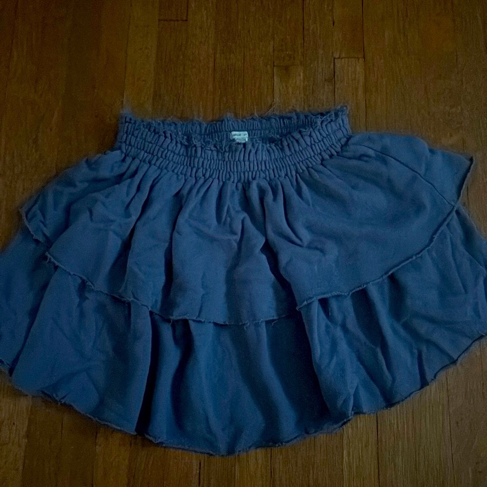 fringe detail around waistband, ruffled bottom, flowy, worn twice